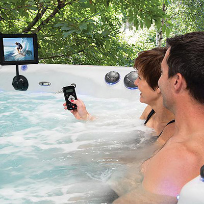 A Couple enjoying their iPod 'Cinema' in their H2X Swim Spa